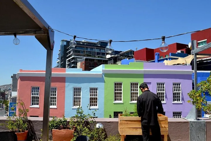 A rooftop terrace looking over painted Bo-Kaap houses